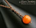 Intense orange coloured faceted jade coil on coil pendant