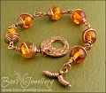 Faux amber and spiral wrapped copper toggle bracelet.