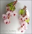 Chain earrings with pink glass blossoms on rosy red copper