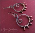 Oxidised copper swirl earrings wrapped with rosy copper buds