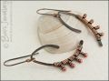 Asymmetric copper wishbone earrings with rosy copper buds