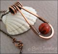 Teardrop shaped antiqued copper and red coral pendant