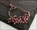 Antiqued copper circle pendant with molten copper buds