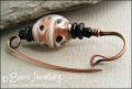 Gold, white and black copper kilt pin