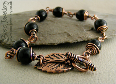 Copper and onyx wire wrapped bracelet with leaf toggle clasp