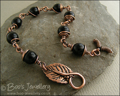 Copper and onyx wire wrapped bracelet with leaf toggle clasp