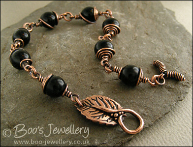 Copper and onyx wire wrapped bracelet with leaf toggle clasp