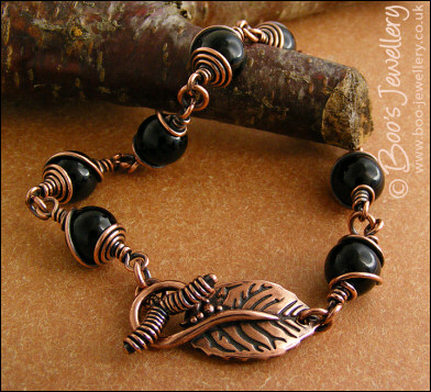 Copper and onyx wire wrapped bracelet with leaf toggle clasp