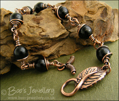 Copper and onyx wire wrapped bracelet with leaf toggle clasp