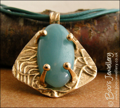 Bronze and Amazonite pendant on leather