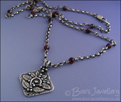 Silver and garnet necklace with square pendant