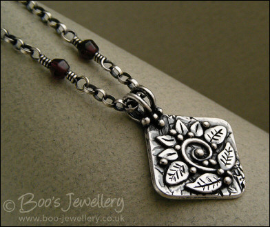 Silver and garnet necklace with square pendant