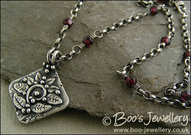 Silver and garnet necklace with square pendant