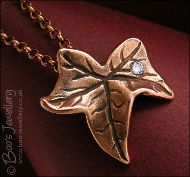 Copper ivy leaf pendant set with Cubic Zirconia raindrop