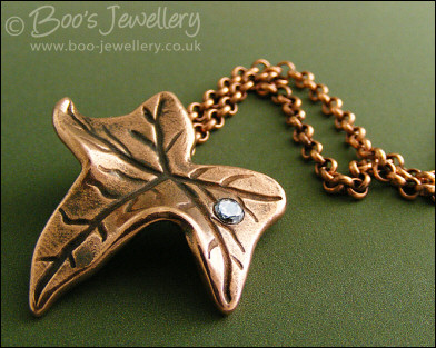 Copper ivy leaf pendant set with Cubic Zirconia raindrop