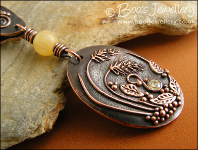 Copper and honey jade pendant with leaves and grasses
