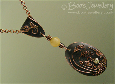 Copper and honey jade pendant with leaves and grasses