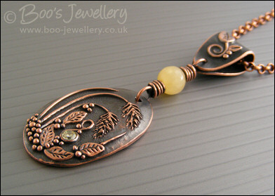 Copper and honey jade pendant with leaves and grasses