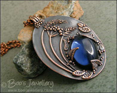 Midnight scene pendant with deep blue cabochon