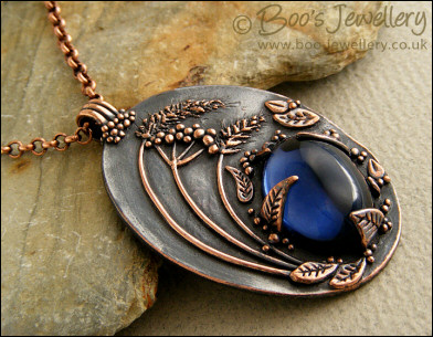 Midnight scene pendant with deep blue cabochon