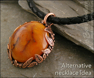Faux amber cabochon and leaf theme pendant