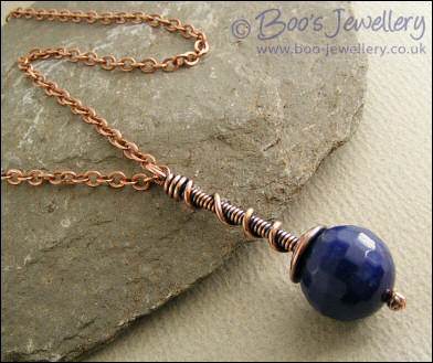Deep blue faceted jade coil on coil pendant