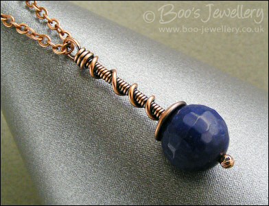 Deep blue faceted jade coil on coil pendant