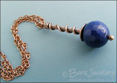 Deep blue faceted jade coil on coil pendant