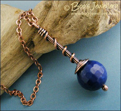 Deep blue faceted jade coil on coil pendant