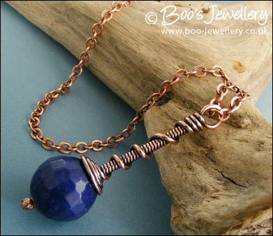 Deep blue faceted jade coil on coil pendant