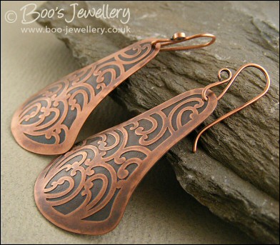 Fan shaped etched copper earrings with scroll design