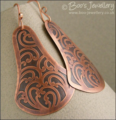 Fan shaped etched copper earrings with scroll design