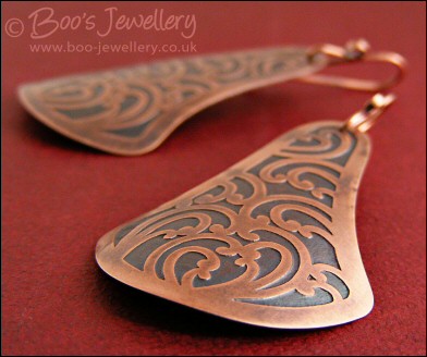 Fan shaped etched copper earrings with scroll design