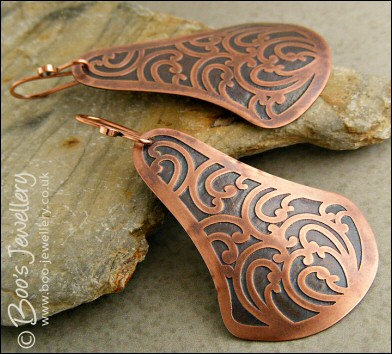 Fan shaped etched copper earrings with scroll design
