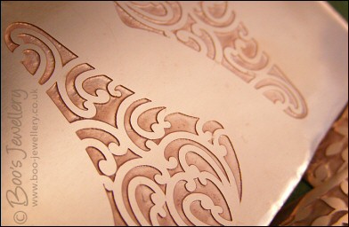 Fan shaped etched copper earrings with scroll design