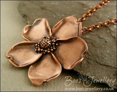 Solid copper hand sculpted wild rose pendant