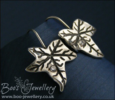 Solid silver one piece ivy leaf drop earrings with cubic zirconium