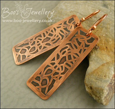 Etched copper earrings with random geometric design