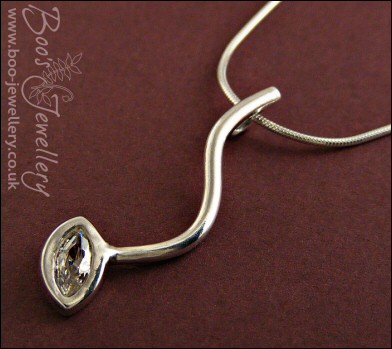 Silver curve pendant set with marquise shaped cubic zirconia