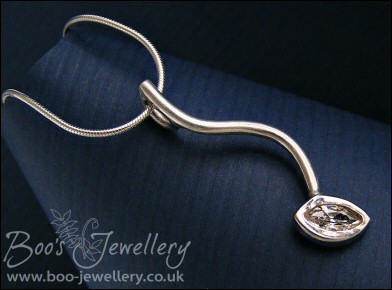 Silver curve pendant set with marquise shaped cubic zirconia