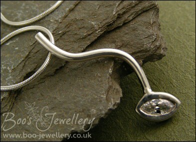 Silver curve pendant set with marquise shaped cubic zirconia