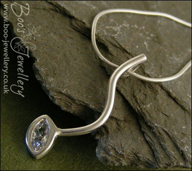 Silver curve pendant set with marquise shaped cubic zirconia