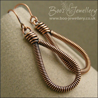 Long teardrop coiled loop earrings in antiqued copper