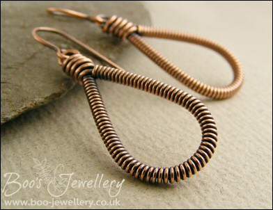 Long teardrop coiled loop earrings in antiqued copper