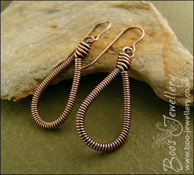 Long teardrop coiled loop earrings in antiqued copper