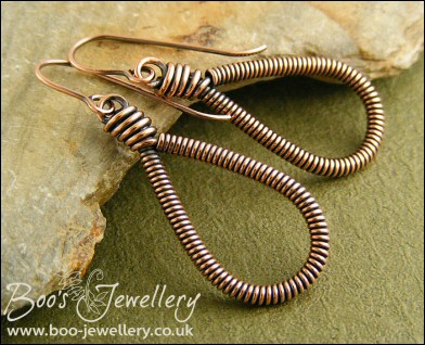 Long teardrop coiled loop earrings in antiqued copper