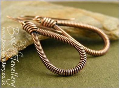 Long teardrop coiled loop earrings in antiqued copper