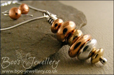 Mixed metal pebble stack pendant on silver chain with matching earrings
