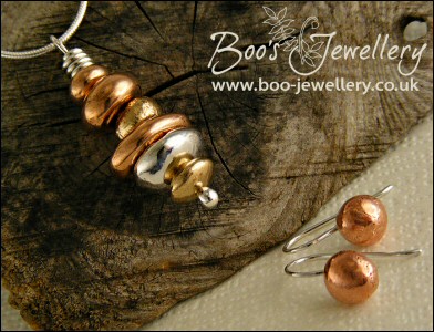 Mixed metal pebble stack pendant on silver chain with matching earrings