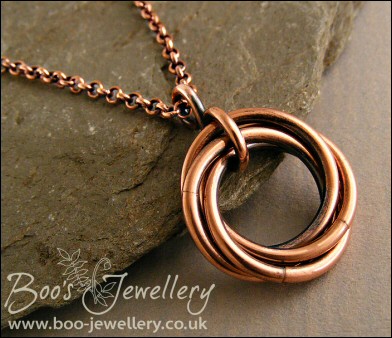 Antiqued copper mobius flower pendant on belcher chain